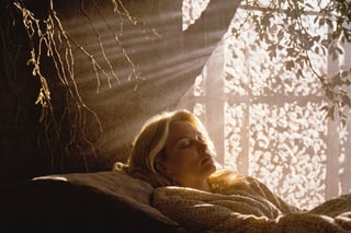 lith_argenta_bromBN1W cinematic film still of a patterned illumination casting a tree branch shadow a blonde woman, sleeping peacefully in the morning sunlight. The golden rays stream through a window, casting gentle shadows around her face.