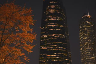 Night, autumn, skyscrapers with orange windows, lanterns illuminate the foliage of the trees and are reflected in the glass of the skyscrapers