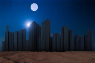 night, dark blue sky with blurry white clouds, full moon, black rectangular skyscrapers with small windows in which white light is visible, metal superstructures are visible at the tops of skyscrapers, brown cubes and a few gray cubes are visible at the base of skyscrapers, the earth is brown mud or clay