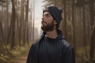 a man standing, using cap, forest background