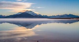 Masterpiece, highest quality, 8k high-quality photos, perfect details, perfect composition, ultra-high definition, the sky over the Salt Lake of Uyuni, the mirror-like surface of the lake, reflections in the water, majestic distant mountains, low mist,