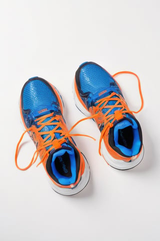 Orange blue sports shoes with white background ،From the top view