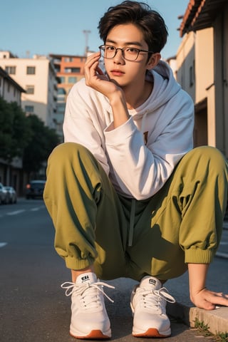 Make a photoshoot portrait of a young Korean man, 18 years old, cool pose, blue hoodie urban, army green jogger pants, white shoes, glasses... sunset sky background, blur lens background, full body shot, legs, long shot,