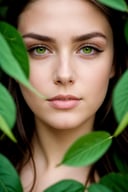 Beautiful young woman with green eyes and long eyelashes looking at camera through green leaves