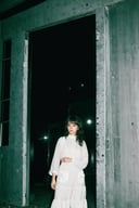 (best quality, masterpiece, intricate details:1.4), a girlie standing inside a dark abandoned building, (at night:1.4), (upper body:0.8), film emulation, bangs,  (realistic), perfect anatomy, low contrast, humidity,  flash,  <lora:flash-000006:0.7>