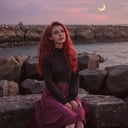aw0k euphoric style, photograph, beautiful woman, Sitting with elbows on knees, dark black and Fuchsia Raging hair, at Overcast, soft focus, Sketched, Beautifully Lit, film grain, Kodak gold 200, Zoom lens, One Color, art by Arnold Schoenberg, <lora:katu:1> <lora:vhsart:1>