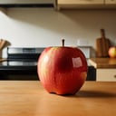 one red apple on table in kitchen