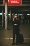 epiC35mm, medium shot of a woman traveller ready for the journey waiting on the train station, detailed sharp, flash photo <lora:epiC35mm:1>