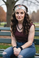 portrait photo, woman wearing casual clothing, dark hair, long curls, headband, sitting on park bench, r4w photo
