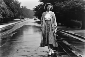 Vintage analog, grainy B & W Photo of a 19yo short girl wearing a plaid shirtwaist dress, long cardigan, walking on wet pavement. Style by J.C. Leyendecker. Canon 5d Mark 4, Kodak Ektar