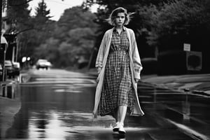 B & W Photo of a 19yo short girl wearing a plaid shirtwaist dress, long cardigan, walking on wet pavement. Style by J.C. Leyendecker. Canon 5d Mark 4, Kodak Ektar