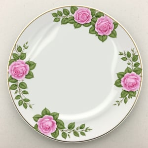 fnxipltz, a white plate with a pink rose design on it