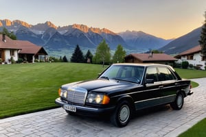 1983 mercedes 300d with a black paint job, parked in front of a house in an alpine area. Sun setting behind the mountains with a view of the valley below
