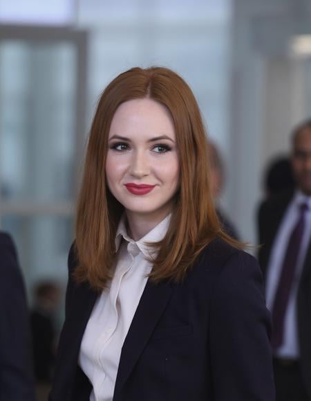 Mid-shot portrait of a woman karen gillan in an hi tech office with blazer and a shirt under <lora:karen_gillan_flux_lora_v1_000002600:1>