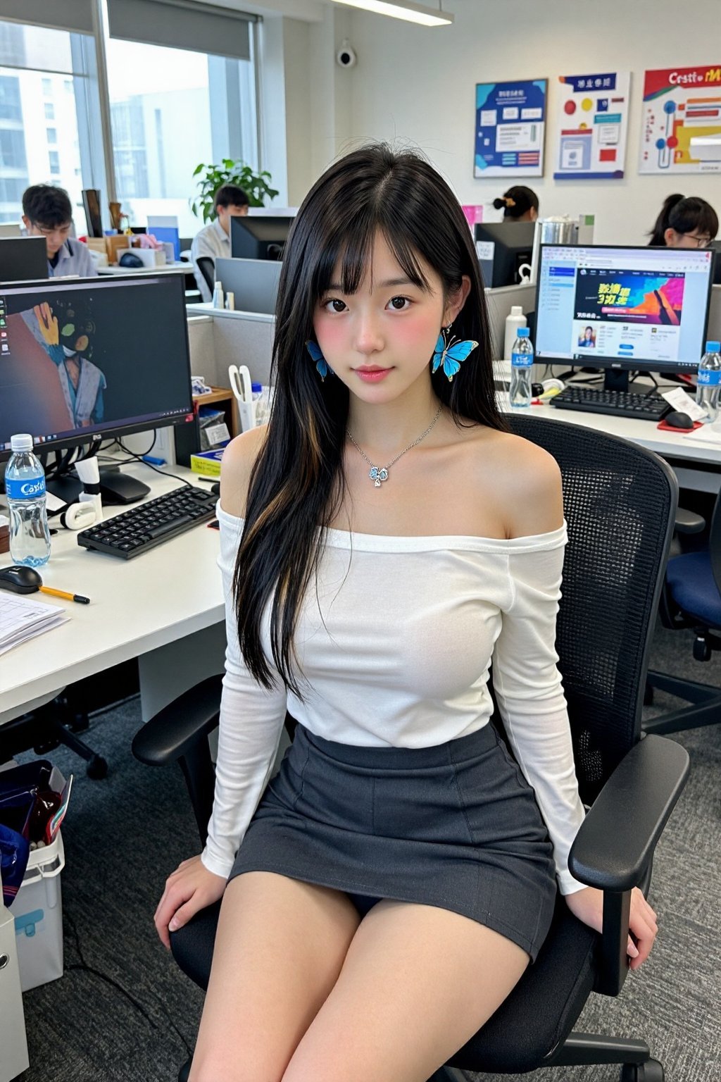 The image is a photograph of an East Asian woman seated in a modern office environment. She has long,  straight black hair...