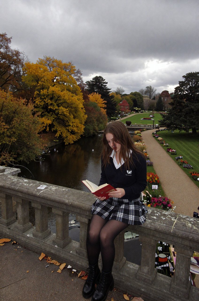 capturing a young woman with long brown hair focused intently on an open red book in her hands while perched on an old sto...