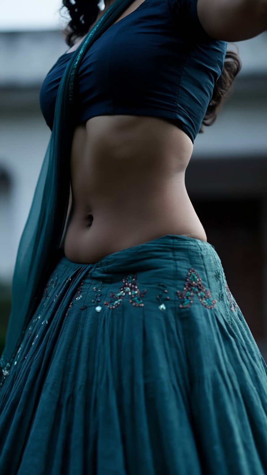 Low-angle,  young Indian woman with a fit hourglass figure,  ultra-low-rise low-waisted designer lehenga skirt by LoRa Fac...