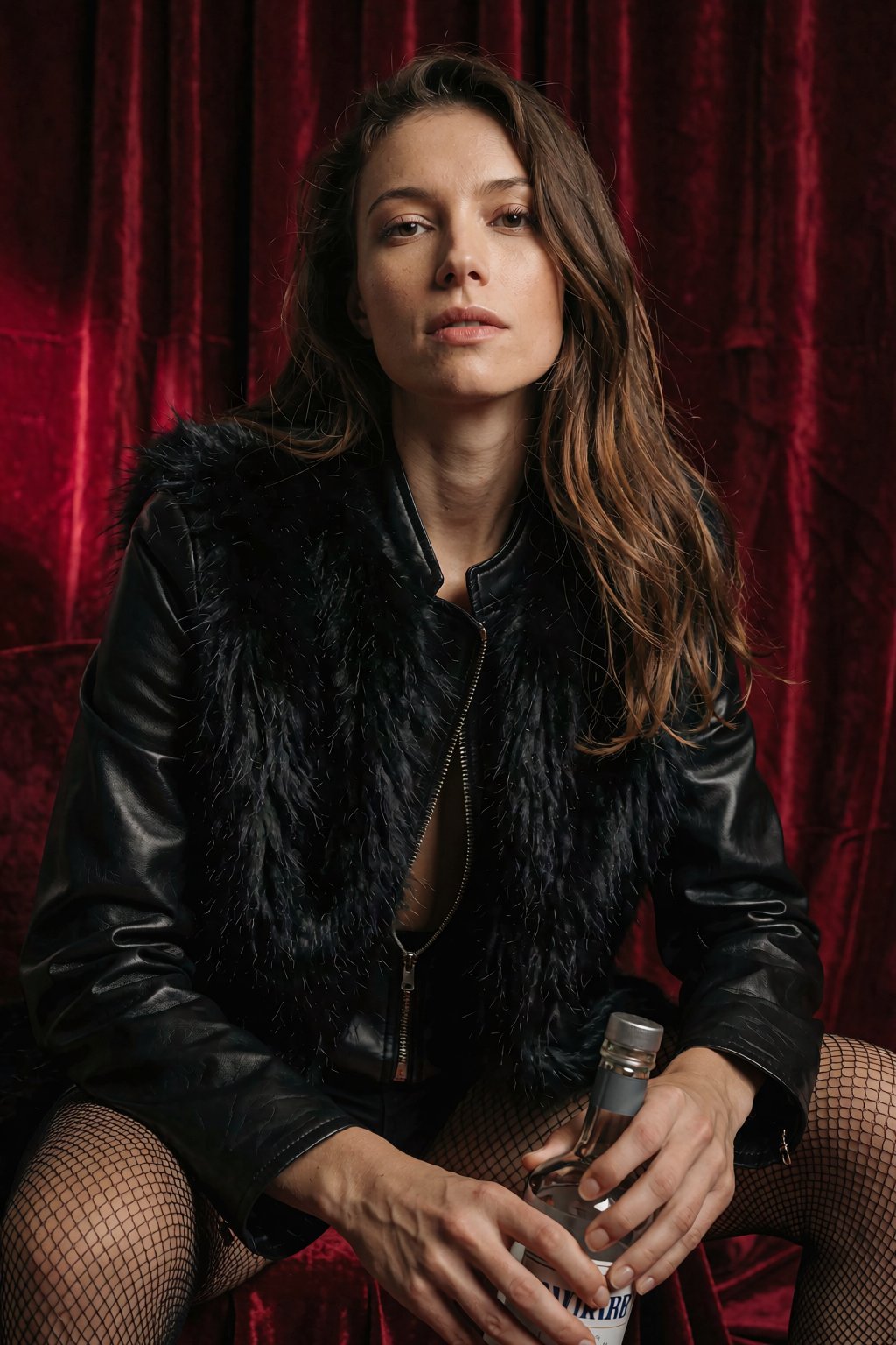 A cinematic studio portrait captures a woman with long brown hair,  her face illuminated by soft directional lighting that...