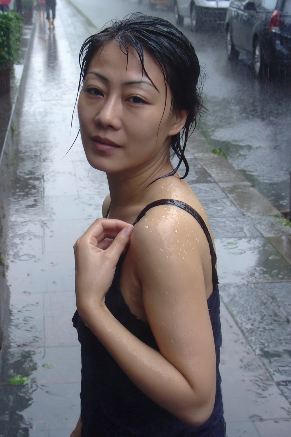 梦核ins 低像素摄影风格,  精致少妇走在雨后街边步道,  脸部转向镜头方向 by 闺蜜 on Tensor.Art