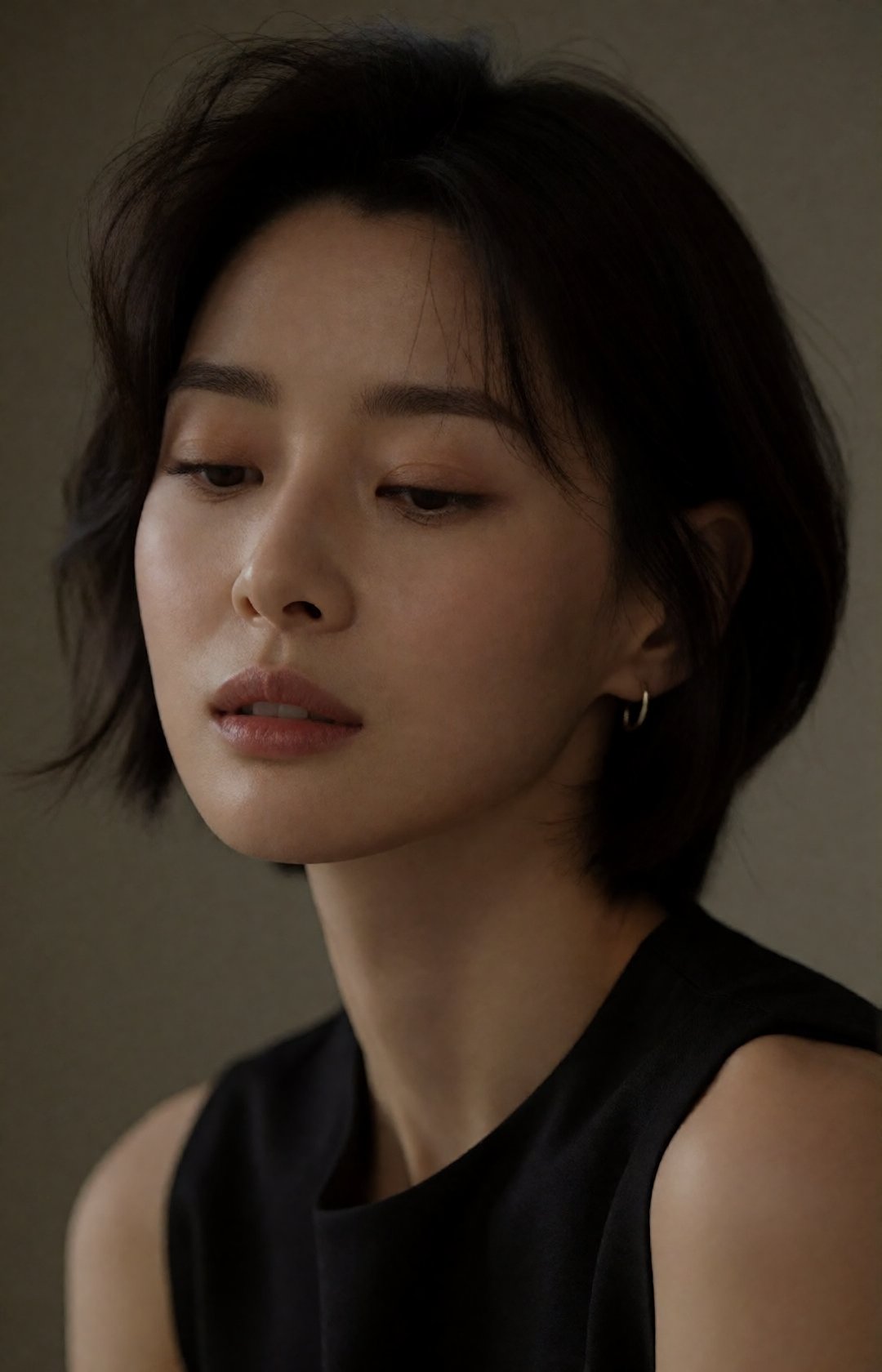photorealistic indoor low-light studio portrait of a chic young Asian woman,  close-up head-and-shoulders framing,  not lo...