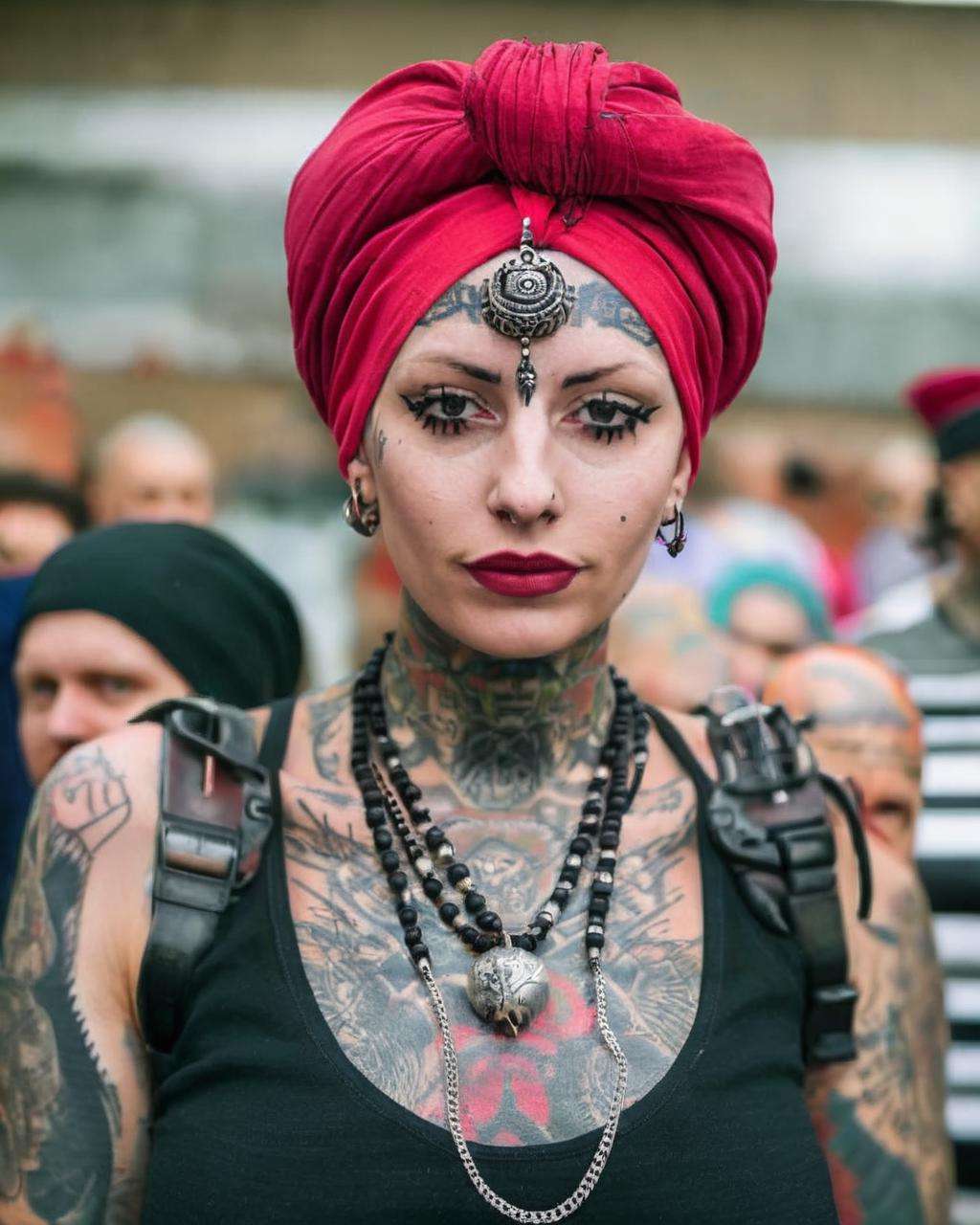 a woman wearing a turban and a necklace ,  alt_style , alternative culture , alternative style , tattoos:0.2,  <lora:alt_style:1.0>