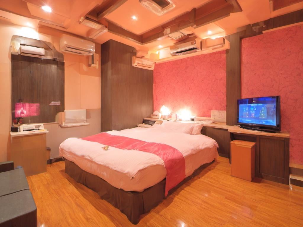 masterpiece, best quality, ultra-detailed, illustration,lovehotel, LHbedpanel, bed, indoors, scenery, lamp, bedroom, television, pillow, monitor, cabinet, light, window, door, table, wooden floor, <lora:Lovehotel_SDXL_V1:1>