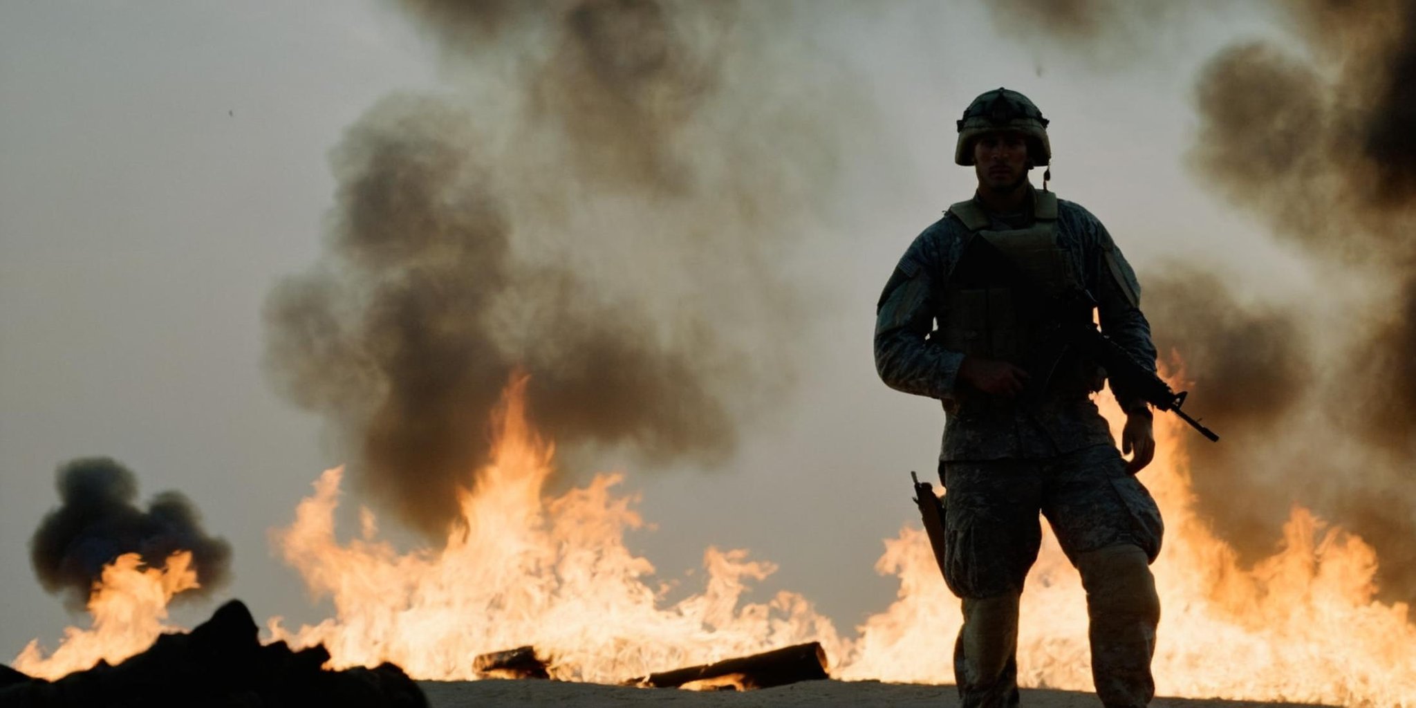 cinematic film still of  <lora:Kodak Motion Picture Film Style:1> HDR<lora:cinematic vintage film:1> cinematic vintage film styleAn Oscar winning movie for Best Cinematography a "silhouette soldier" is standing in front of a fire in gulf war Kodak Motion Picture Film Style, shallow depth of field, vignette, highly detailed, high budget, bokeh, cinemascope, moody, epic, gorgeous, film grain, grainy