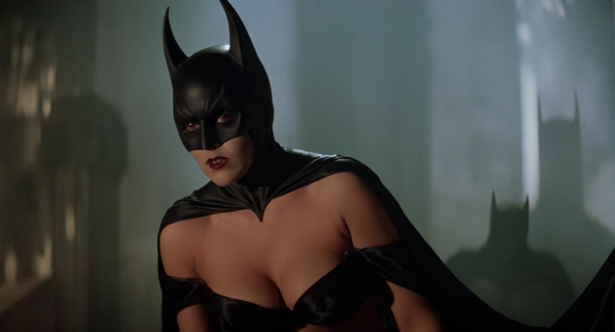 cinematic film still of Cinematic Film stock footage in (arri alexa style) Kodak film print,  female Batman Vampire a nake...