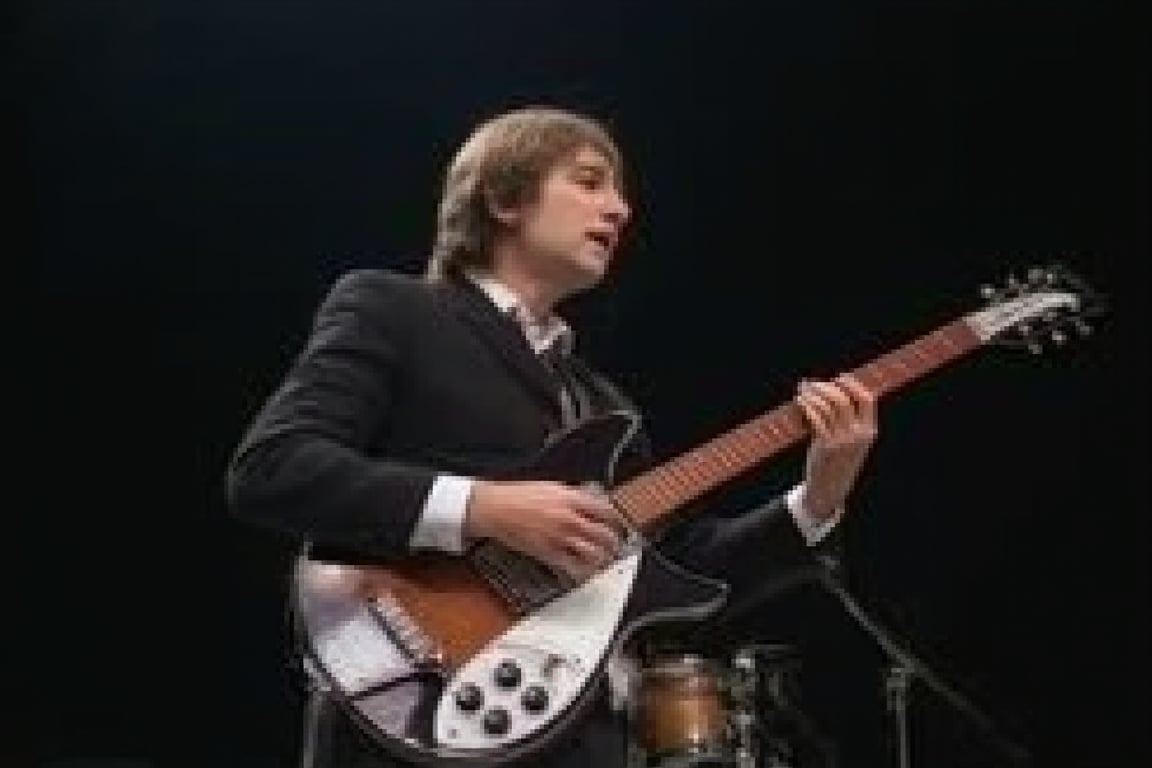 1boy,solo,John Lennon of the Beatles, front view,half body, standing, playing Rickenbacker electric guitar in a nightcub on stage