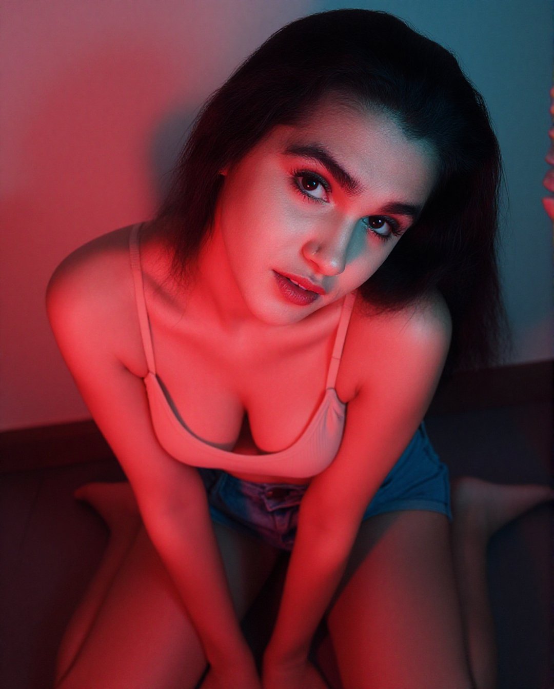 Create a portrait without changing facial features. Close-up a young woman with a full bust,  she sits on the floor on her...