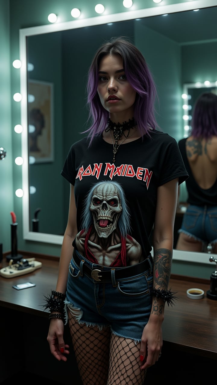 A cinematic 35mm photo captures a striking Nordic woman (25) in a dimly lit dressing room. She stands confidently before a large, illuminated mirror, wearing a worn Iron Maiden shirt, ripped denim shorts, and fishnet stockings. Her black and purple hair, gothic makeup, and edgy accessories (spiked choker, wristbands) complete her look. A sleeve tattoo adorns one arm. The image, shot with a Canon EOS R5, employs Rembrandt lighting for dramatic effect. Hyper-realistic details showcase the texture of her clothing and the intensity of her gaze. The composition balances intimacy with artistry, creating a powerful portrait that embodies epic realism. The dressing room background is slightly blurred, keeping focus on the subject. The photo exudes a provocative yet artistic atmosphere, capturing the essence of gothic rock style.