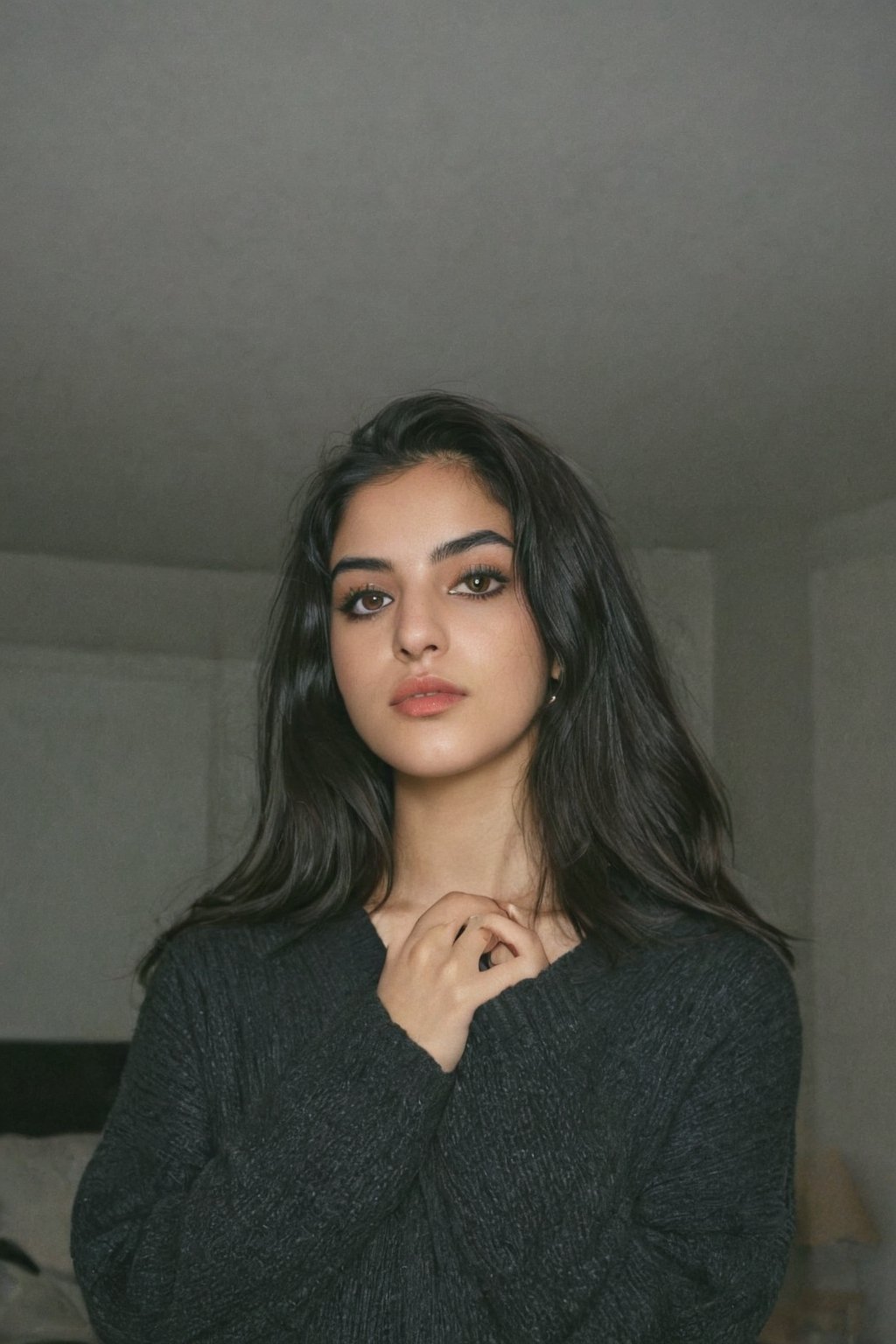 Generate hyper realistic image of  a 20-year-old  Persian woman with an hourglass figure, wearing an oversized sweater that hints at a playful rebellion. Dark makeup enhances her mischievous expression as she enjoys her bad girl persona at home.upper body shot.Extremely Realistic