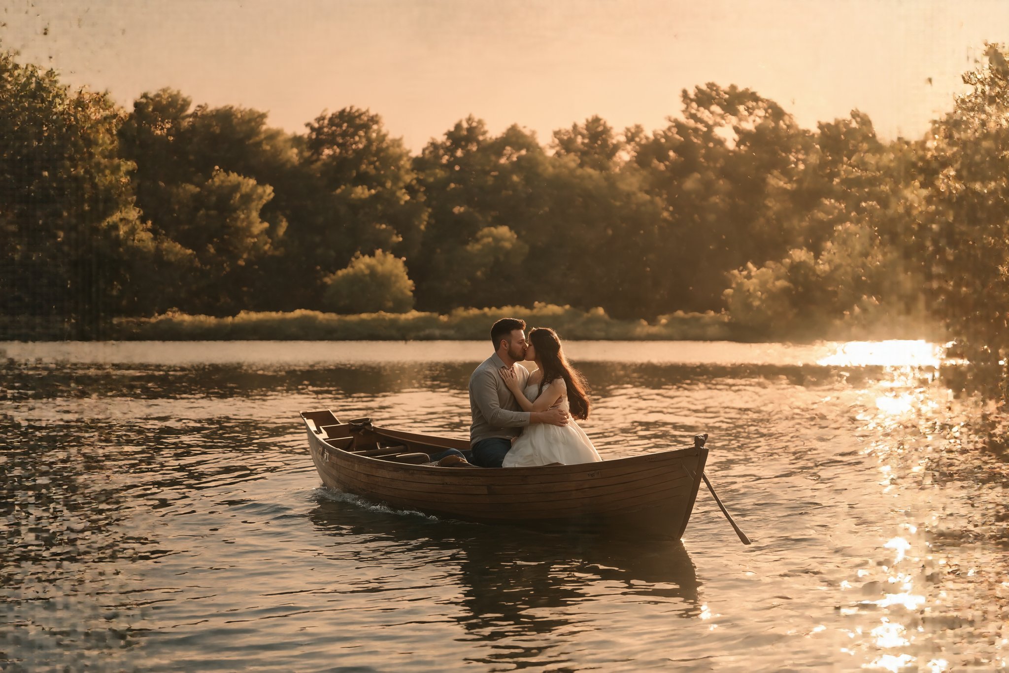 Romantic sunset over a tranquil lake. Couple kissing on a small wooden rowboat. Golden light reflecting on calm water. Man and woman in intimate embrace, silhouetted against vibrant orange and pink sky. Ripples around the boat, creating subtle reflections. Lush trees lining the distant shore. Long shadows stretching across the water's surface. Dreamy, soft focus atmosphere. Highly detailed, photorealistic style with painterly touches. 8K resolution, focus on the couple and immediate surroundings. Warm color palette emphasizing the romantic mood. Masterpiece quality, emotional impact.