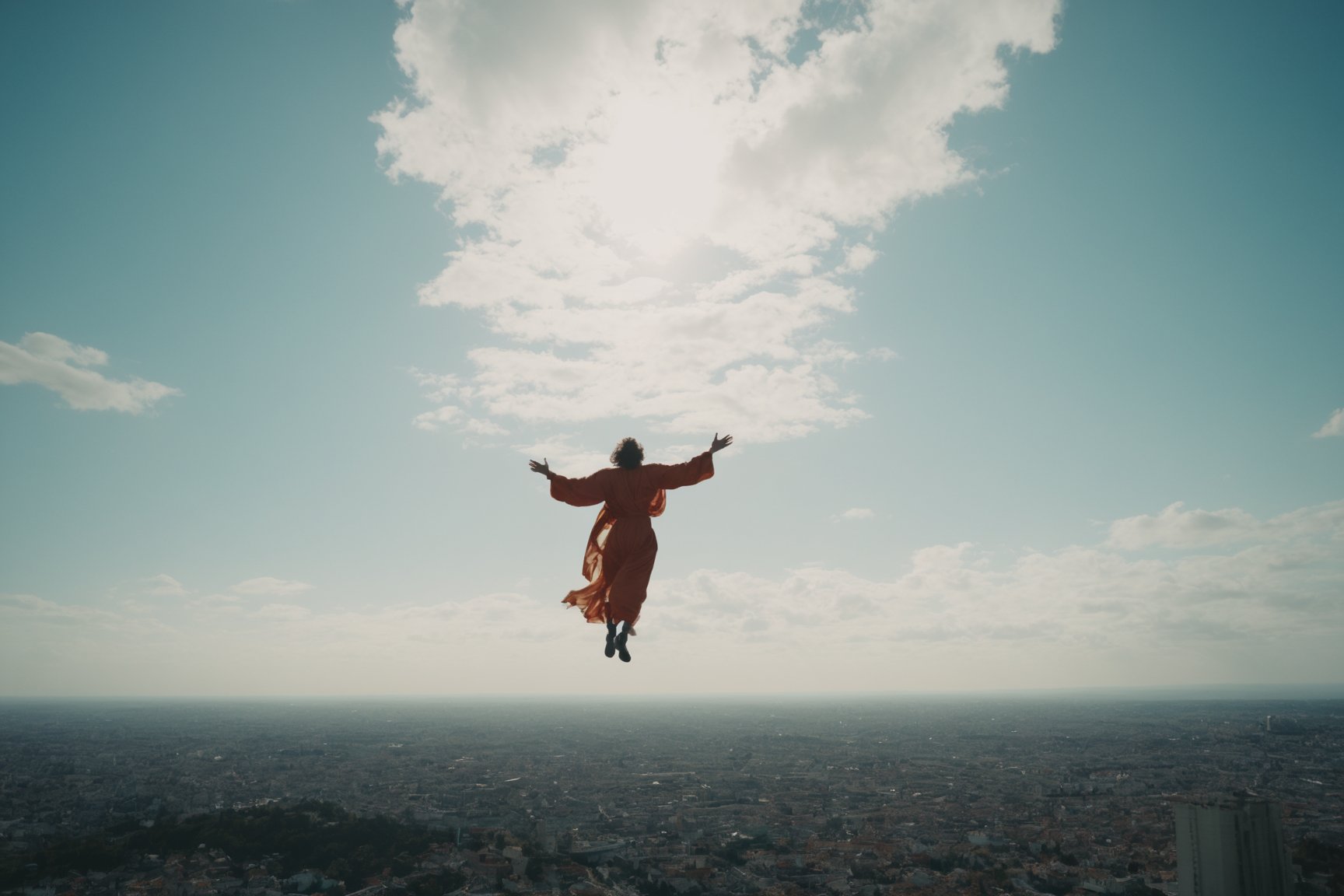 ake a picture of a shining person's form float in the air high over the small city, cloud, wide shot, Hyper-detailled, 32k, Super High definition, Vibrant Colors, Soft focus, Ultra Smooth,Soft natural look, Full shot, art by Lenkaizm, photorealistic, realism, movie still, film still, cinematic shot, dreamwave, aesthetic,photo r3al