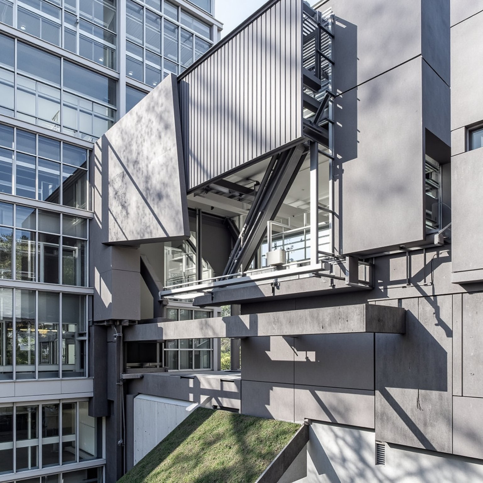 An architectural structure characterized by geometric forms with vertical and horizontal walls and asymmetrical openings t...