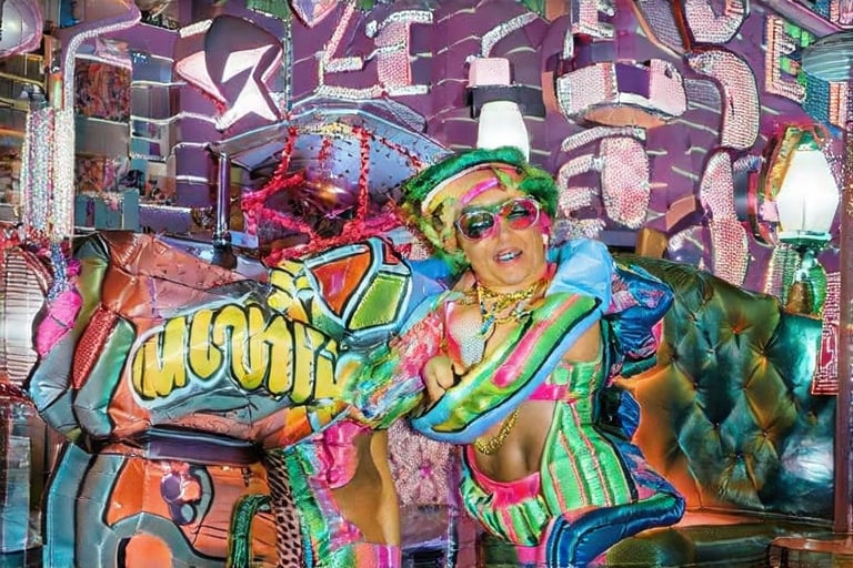 An award winning journalist Photograph, of a man and a woman wearing multi-colored inflatable outfits, in a funky love hotel having sexual intercourse, well lit cinematic lighting, complex shadows, extremely detailed , hotshoe flash on subject, text reads:"love hotel" , 1990s Photoshop style