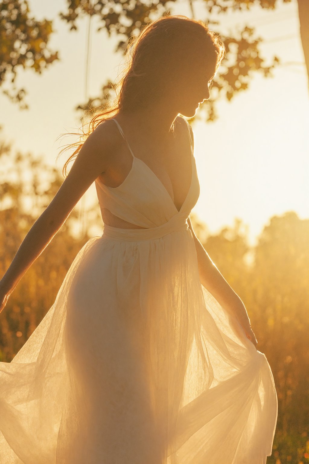 Prompt: A stunning 20-year-old Korean woman stands fully within the frame, radiant with elegance. Backlit by warm sunlight, her modern white dress billows softly around her, hair and fabric fluttering harmoniously. Her smile, a masterpiece of subtlety, illuminates her entire face. The camera captures every detail: luscious long locks, toned physique, and delicate features. An 8K resolution showcases the breathtaking bokeh, cinematic lighting, and raw beauty. Her figure fills the frame, inviting the viewer's gaze to linge,