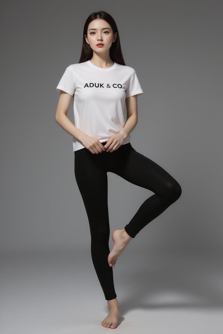 A striking image: a sexy girl with sexy long legs and feet standing dynamic pose on a sleek gray surface. His porcelain skin is set off by the vibrant red hue of her lips, while the stark contrast between her white tshirt graphic text with helvetica font, text " ADUK & CO ". Shes wearing black fit yoga phants. and the all-gray background creates an air of sophistication and elegance.