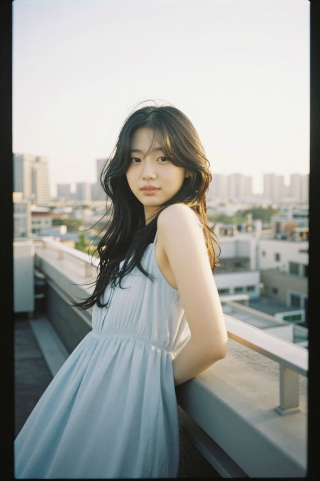 An alluring Korean woman in her 20s wearing a light summer dress (light blue,  flowing),  leaning casually against a rooft...
