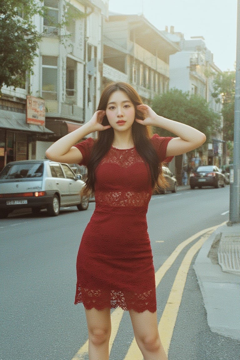 Young woman, wearing tight lace dress, in the middle of the street