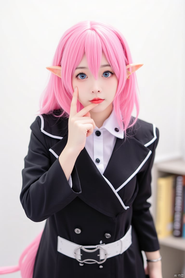 a cosplay girl dressed in a black and white costume, adorned with a white collar and a black belt. Her hair is a vibrant shade of pink, adding a pop of color to the scene. Her eyes are a piercing blue, and her lips are a bright pink. Her eyebrows are a darker shade of black, adding depth to the composition. She is wearing a pair of pointed ears, a matching pink tail, and a matching black shirt with white trim. The shirt has a black collar with white buttons and a white belt. The woman's left hand is resting on her chin, while her right hand rests on her left hand. She stands in front of a white wall, with a bookshelf on the right side of the frame.
