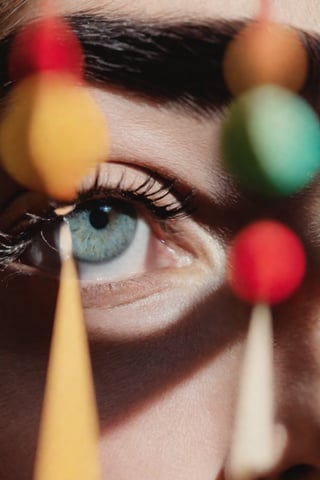 Extreme close up of a 24 year old woman’s eye blinking, standing in Marrakech during magic hour, cinematic film shot in 70mm, depth of field, vivid colors, cinematic