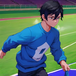 A boy of about 18 years of age.
Short black hair.
Sweat on his face.
Wearing a blue sweatshirt.
standing and running on a long plastic track.
