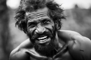 a defeated bare knuckle boxer male, old b;ack african man, head uncovered,  battle scarred, solo, looking at viewer, 1 man, monochrome, upper body, greyscale, male focus, 2 ft facial hair,2 ft beard, 12 inch mustache, old, old man, no clothing, long bushy unkempt hair, long bushy beard, wild and windswept, forlorn, a worn out worried look in his eyes and face, all focus on the eyes, short 2 inch depth of field, tamron 1000 mm telephoto lens, f2.8, cinematic angle, looking from above the eyeline down back at the man, angled, extreme close up shot,  eyes only, teeth bashed out, swollen eye, broken nose, cut eyebrows, no teeth, a towel, a singlet, bloodstained, mouth open and smiling , few teeth, 