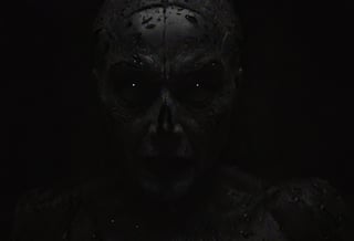 vntblk, cinematic, (((black and white, monochrome, bw))), BREAK, extreme close up shot, of a evil, male, demon, glowing eyes, masculine, bald, long horns adorn his head, glowing terrifying white eyes, looking at viewer, sharp pointed nose, wicked grin, sharp teeth, pointed ears, (skin pores:0.2), in a dark, dimly lit, cave, at night, BREAK, you sold your soul and now it's time to pay your debts, BREAK, rim light, sharp contrast. 4k, high quality, ,black,smoke on the water