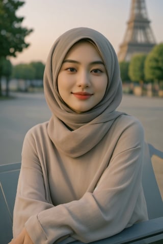 portrait of a beautiful girl, wearing a Islamic hijab, best quality, 4k, high resolution, masterpiece: 1.2, highly detailed, realistic: 1.37, Eiffel tower background, sitting on a park chair, natural,asiangirl