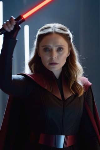 Elizabeth Olsen as a Sith Lord poised to attack with her red bladed lightsabre, she looks sinister and one hand is outstretched as she uses the force powers