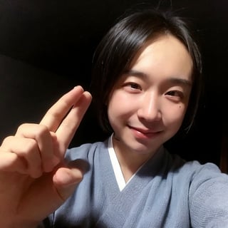 4k,best quality,masterpiece,20yo 1boy,(traditional Japanese costume, alluring smile, head ornaments 

(Beautiful and detailed eyes),
Detailed face, detailed eyes, double eyelids ,thin face, real hands, muscular fit body, semi visible abs, ((short hair locks:1.2)), black hair, black background,


real person, color splash style photo,
