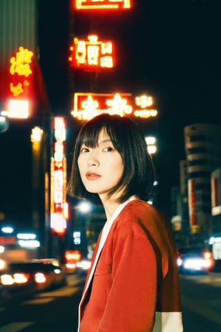 A young Asian woman, short hair, wearing a red jacket and a white t-shirt with Japanese text, necklace, standing on a Tokyo street at night, with Tokyo Tower in the background, illuminated city lights, red lanterns, urban style, night photography, candid pose, low angle shot, with a hint of film grain.


