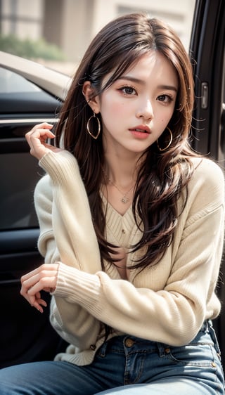 1girl, solo, long hair, looking at viewer, brown hair, long sleeves, brown eyes, jewelry, sitting, earrings, pants, necklace, blurry, sweater, lips, denim, ground vehicle, motor vehicle, jeans, hoop earrings, realistic, blue pants, car, white sweater, hand on own chin